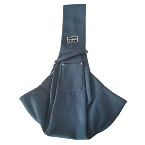 Detailed view of dark blue pet carrier sling bag with wide strap and front storage pocket