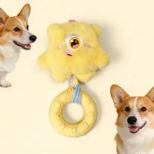 Yellow monster plush dog chew toy with squeaker and donut rubber ring detail
