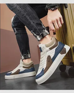 Detail of men's high-top sneakers featuring quilted sides and a knit sock-style collar.