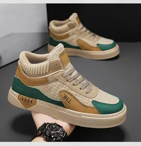 Detailed view of khaki and green mid-top sneakers with knit collar and 'BLL' logo