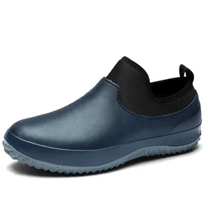 Close-up side view of waterproof navy blue slip-on shoes with flexible black neoprene collar