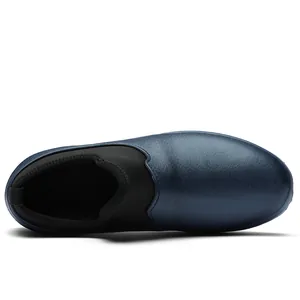 Top-down view of navy blue waterproof slip-on shoes featuring a black elastic ankle collar.