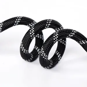 Close-up macro detail of durable black and silver reflective nylon braided dog leash rope
