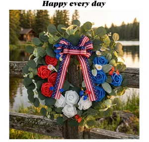 Patriotic Independence Day wreath featuring red white blue roses on a rustic wooden fence lake view