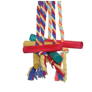 Detailed macro view of colorful braided cotton ropes and wooden blocks for parrots
