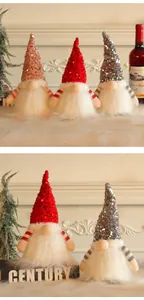 Close-up of sparkling sequined Christmas gnomes with glowing LED lights for home decor