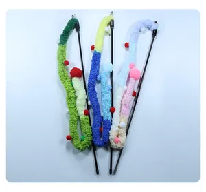 Close-up detail showing three colorful plush cat teaser wands with soft vibrant pom-poms