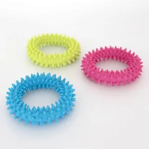 Detailed view of three colorful TPR spiked ring dog toys for effective teeth cleaning