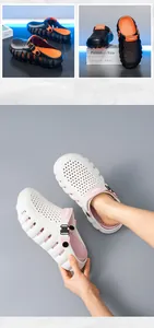 Detailansicht von bequemen Sommer-Clogs mit dicker Sohle in Weiß und Schwarz-Orange