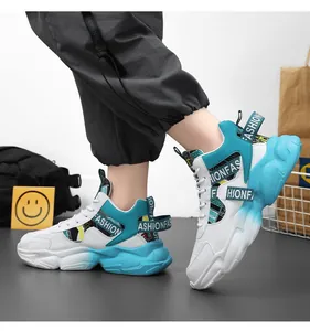 Side view detail of cyan and white thick-soled sneakers featuring fashion letter straps