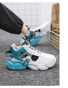 Detailed view of white and cyan thick-soled high-top basketball sneakers for men.