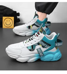Detailed view of white and blue high-top basketball sneakers with thick soles