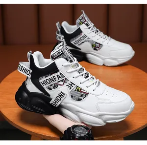 Detailed view of men's black and white chunky platform sneakers with leather finish.
