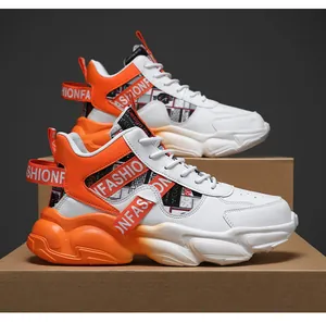 Detail view of men's chunky basketball sneakers with orange straps and waterproof upper