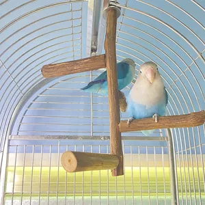 Natural wood bird perch stand inside a cage featuring two blue lovebirds