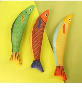 Detail view of three colorful saury-shaped catnip toys with realistic textured scales
