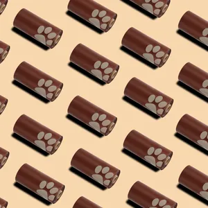 Detail showing repeating pattern of brown recycled pet poop bags with paw prints