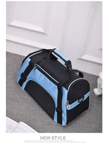 Breathable blue and black mesh pet carrier bag with top handle and adjustable strap