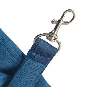 Close-up of durable metal snap hook on blue pet shoulder bag strap