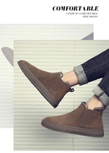 Detailed view of men's brown suede Chelsea boots with durable thick rubber soles