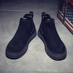 Retro men's black suede Chelsea boots with a thick textured sole and elastic side panels