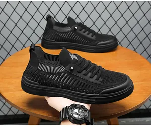 Close-up of black fly-knit men's low-top sneaker showing material texture