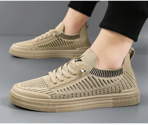 Detailed side view of khaki fly-knit men's sneakers with breathable mesh and durable ribbed sole