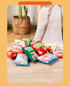 Collection of colorful plush squeaky potato chip bag toys for small dogs on a carpet