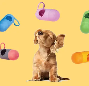 Colorful bullet-shaped pet waste bag dispensers floating around a cute puppy