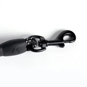 Detail view of heavy-duty black metal swivel snap hook on reflective braided dog leash