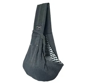 Durable gray pet sling carrier bag for small dogs and cats with checkered lining.