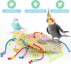 Detail of colorful woven parrot mats with safe-to-chew ropes and metal bells.