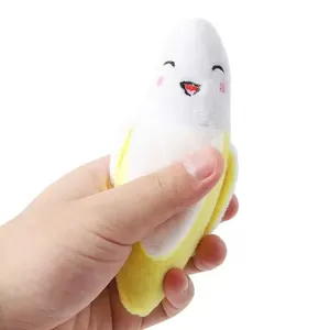 Miniature soft plush banana dog toy with a cute smiling face for puppy interactive play
