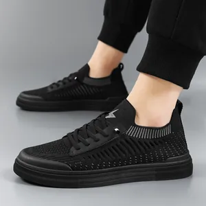 Breathable black flying knit casual sneakers for men featuring a sporty lace-up design