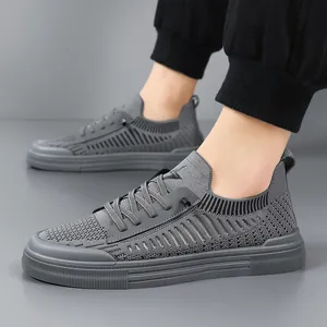 Men's grey flyknit casual sneakers with low-top lace-up design for outdoor comfort.