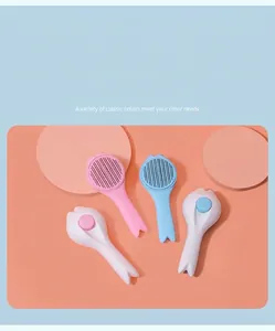 Self-cleaning pet grooming brushes in pink and blue featuring a one-click hair release button