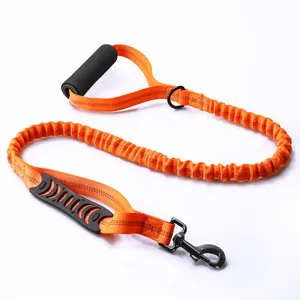 Heavy-duty orange bungee dog leash with dual handles and reflective stitching