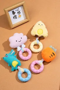 Detailed view of various plush dog squeaky toys with TPR donut chew rings for pets