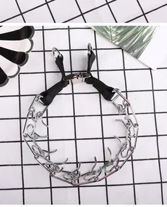 Professional silver metal dog prong collar with black nylon strap and quick-release buckle