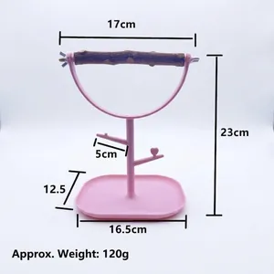 Portable pink plastic parrot training stand with natural wood perch and dimensions