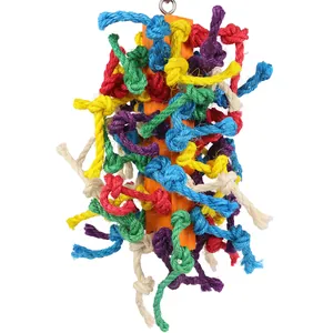 Close-up detail of colorful knotted cotton rope parrot chew toy with orange wooden core