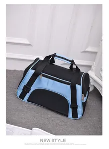 Close-up detail of a breathable blue and black mesh pet carrier for cats and dogs