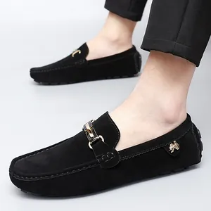 Elegant black suede loafers for men featuring a gold buckle and slip-on design