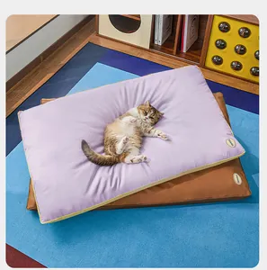 Detail view of a lavender waterproof pet mat with a cat resting on a colorful rug