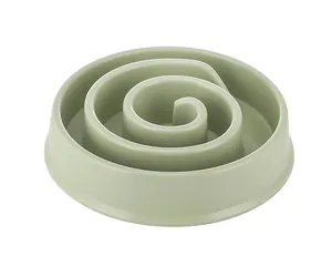 Detail view of a sage green spiral pet slow feeder bowl for healthy eating habits.