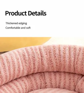 Macro detail of a plush pink pet bed showing the thickened rim and soft faux fur texture.