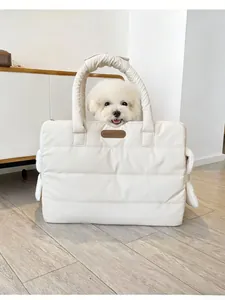 Detailed view of a white quilted portable pet carrier bag for dogs and cats travel