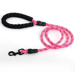 Durable reflective pink dog leash featuring a comfortable black foam handle and metal clasp.