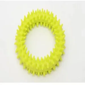 Close-up of durable yellow TPR spiked ring for dog dental care and teething training