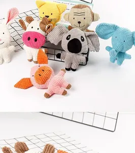 Detailed macro view of colorful corduroy plush squeaky dog toys in various animal shapes.
